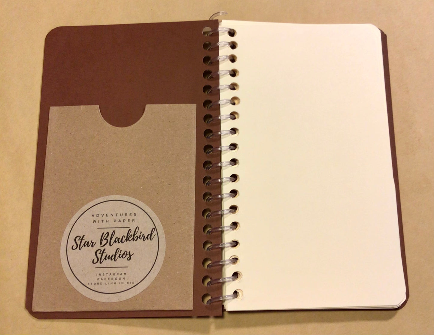 Paperback cover slimline notebook.