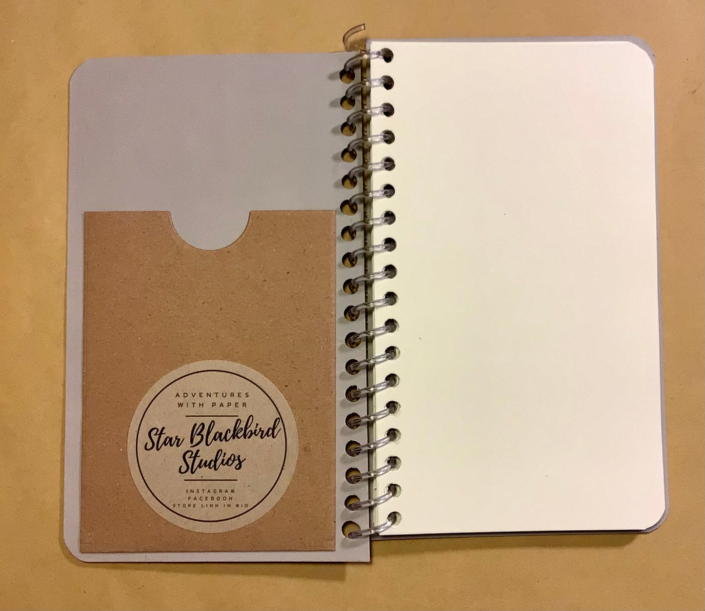Paperback cover slimline notebook.